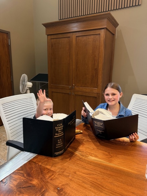Girl and Boy holding book